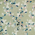A close-up of a fabric pattern featuring watercolor-style eucalyptus leaves in shades of blue, navy, white, and soft pink on a muted sage green background.
