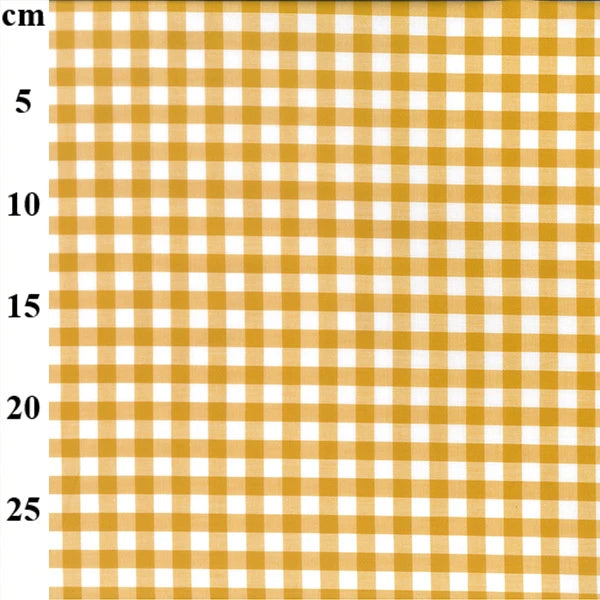 A close-up of a yellow and white gingham checkered fabric pattern with a vertical cm measurement scale on the left side.