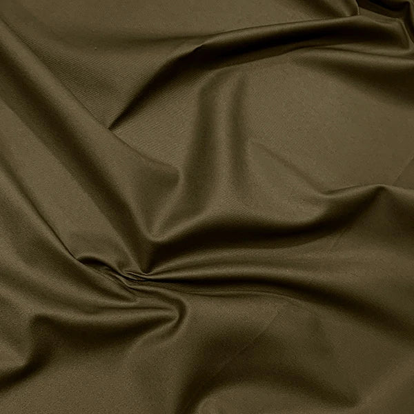 A close-up of draped olive green fabric with soft folds and a smooth texture.