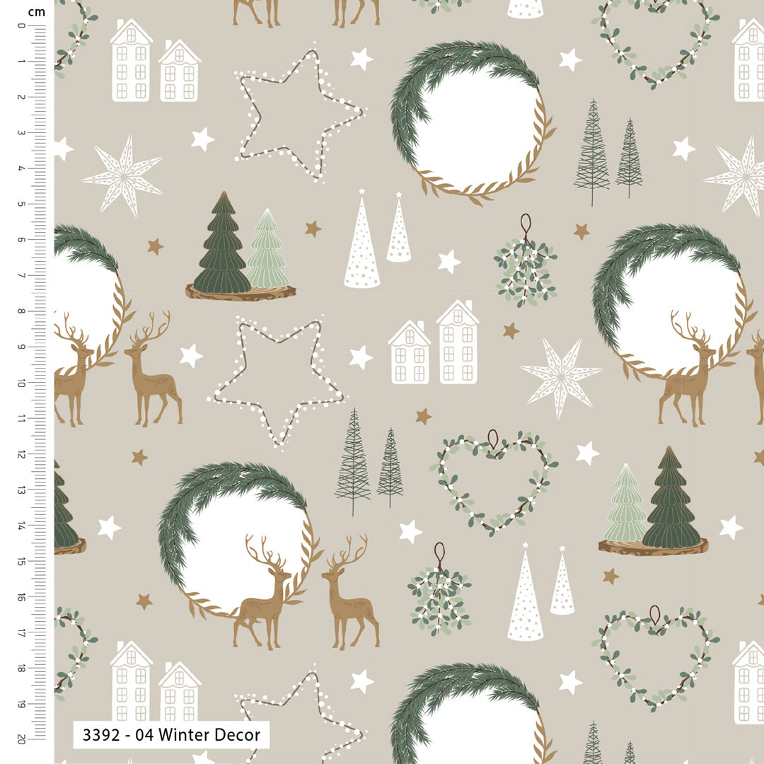 A repeating winter-themed pattern on a warm beige background, featuring green wreaths, white stars and houses, brown deer, evergreen trees, and small hanging ornaments. A ruler scale appears along the left edge, and the text '3392 - 04 Winter Decor' appears at the bottom left.