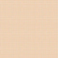 A close-up of a repeating gingham pattern in warm peach and white, filling the entire frame.