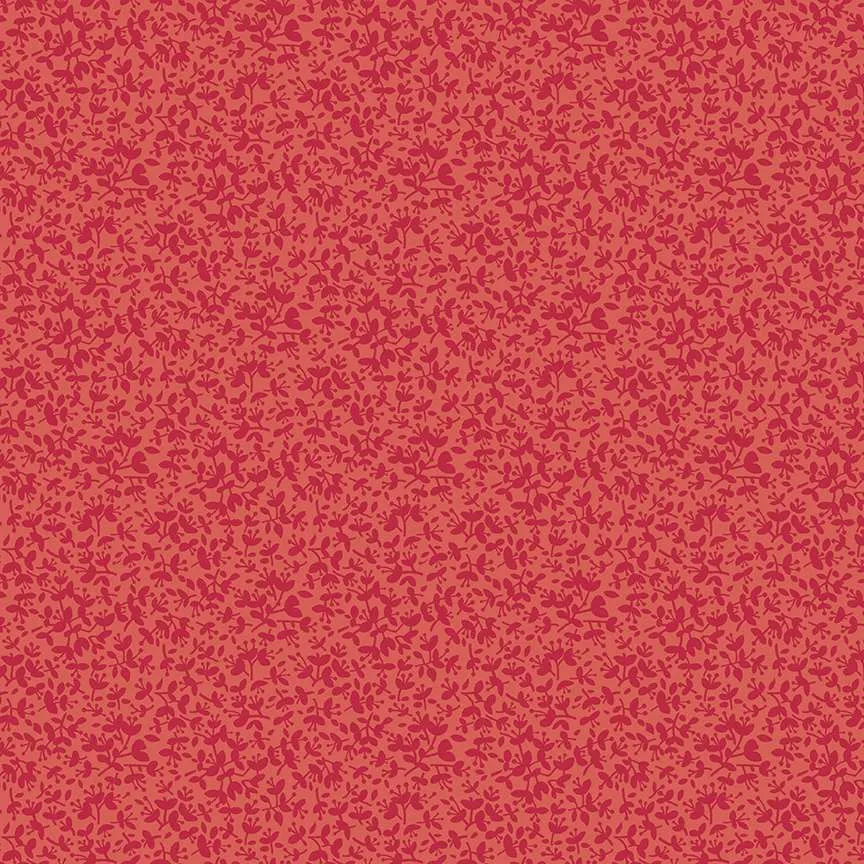 A close-up of a repeating floral pattern in shades of pink and red, filling the entire frame.