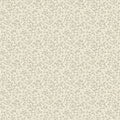 A close-up of a repeating floral pattern in soft sage green on a warm cream background.