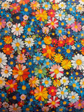 A close-up of a dense floral pattern featuring multicolored daisies and small flowers on a dark navy background.