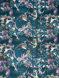 An abstract, full-frame patterned design with a dark teal background and scattered purple, white, beige, and metallic gold marbled splatters.