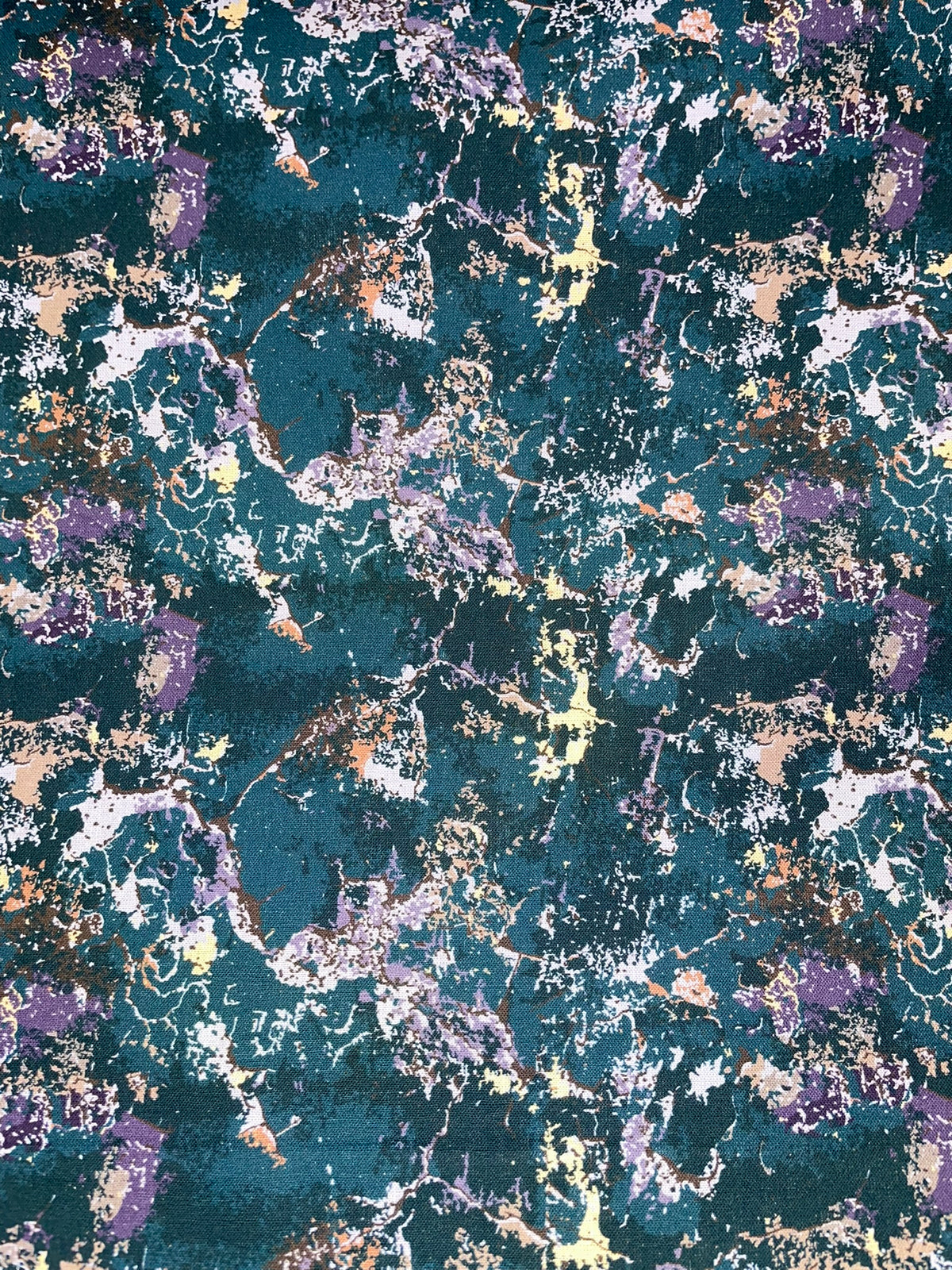 An abstract, full-frame patterned design with a dark teal background and scattered purple, white, beige, and metallic gold marbled splatters.