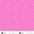 Pink and white geometric pattern fabric with a ruler for scale