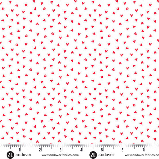 Fabric with red hearts on a white background, featuring Andover Fabrics branding.