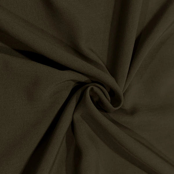A close-up of draped fabric in a very dark olive brown color, gathered in the center to show its texture and drape.