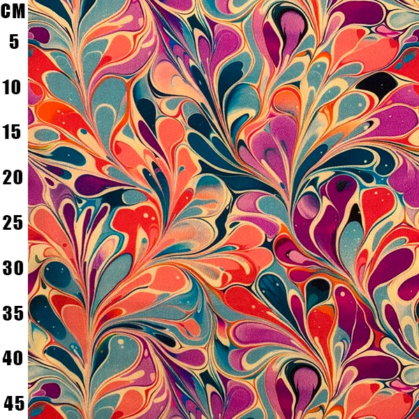 A close-up of a colorful marbled pattern with swirling abstract shapes in orange, purple, teal, pink, cream, and black. A vertical black ruler on the left edge shows measurements in centimeters from 5 to 45.