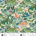 Fabric with colorful dinosaur pattern and ruler for scale