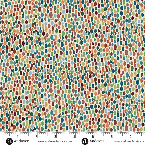 A close-up of a fabric pattern featuring a dense, hand-drawn style polka dot or leaf-like dot design in multiple colors including orange, green, blue, red, and beige on a white background, with a white ruler at the bottom showing scale and Andover Fabrics branding.