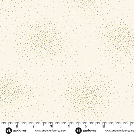 A fabric pattern swatch showing a cream background with small olive green dots arranged in horizontal bands of increasing density. A ruler and Andover brand markings are visible along the bottom edge.