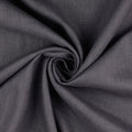 A close-up of dark charcoal gray linen fabric arranged in a spiral drape, showing the material texture and color.