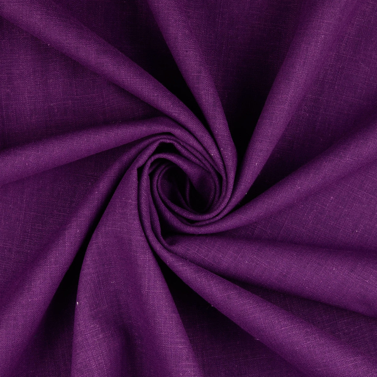 A close-up of draped purple linen fabric arranged in a spiral pattern, showing the material's texture and color.
